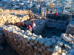 Late Bronze Age brick wall and sacred niche being uncovered from the cement cocoon we created for it in 2004.  The following photos illustrate the process of recovery.