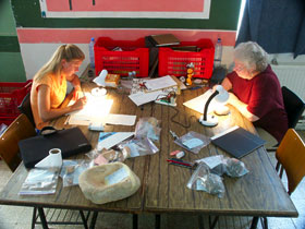 Artists Rhonda Root and Stefanie Elkins, drawing artifacts