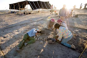 Documenting archaeologists with new Bedouin tent in the background