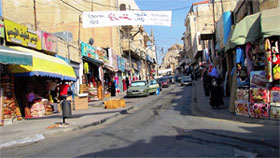 Madaba street with tent-maker's shop a few doors up on the left