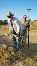 “Kent planting a perimeter stake with the help of GPS Mapping from Matt
