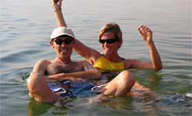 Ken Crane and Rebecca Waring-Crane floating in the Dead Sea