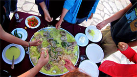 Many hands in the mansaf