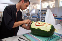 Munir carving watermelon