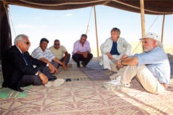 HE Akel Biltaji talking with several in the dig's Bedouin tent