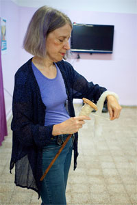 Mary Boyd demonstrating the use of a modern spindle