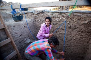 Adel's daughter gets started on her future career early, helping her father and Carolyn Waldron excavated in Square 6K56.