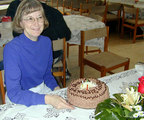 Carmen Clark enjoying her 29th birthday at ACOR in January -- cake prepared and decorated by Pierre Bikai, flowers from Guiding Star Travel, her good husband's gift an Oud - Arabic gourd-shaped guitar